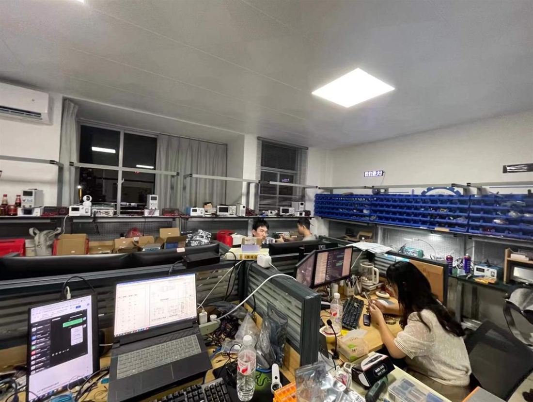 Our engineers at the electronics benches in Shenzhen